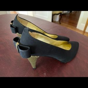 Elegant Charles Jourdan black suade gold heel bow